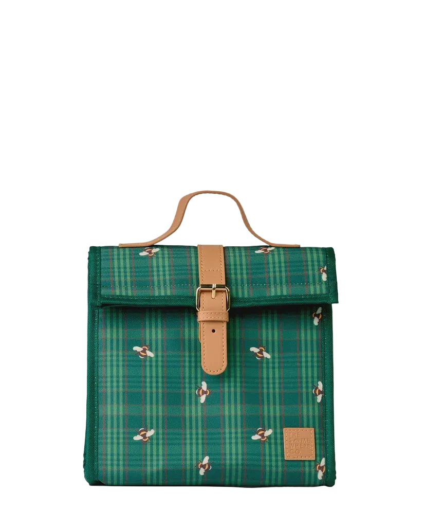 A green plaid insulated lunch bag with a flap closure, tan leather handle and buckle strap, and small bee motifs, shown on a light gray background.
